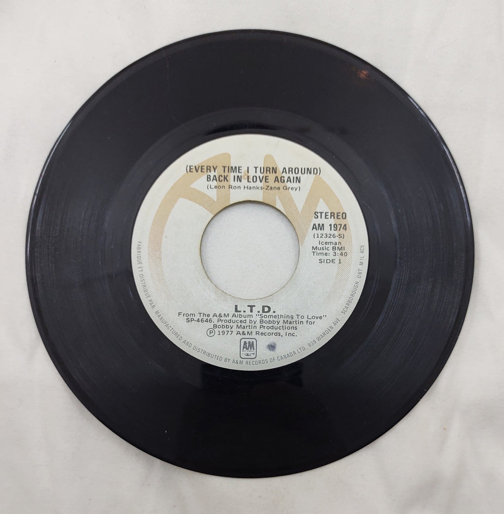 L.T.D. – (Every Time I Turn Around) Back In Love Again 7” A&M AM 1974